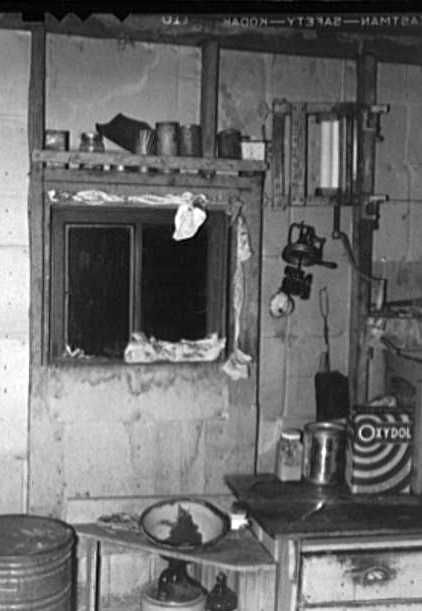 Kitchen window stuffed with towels and clothing in dust storm area. Williams County, North Dakota - Russell Lee