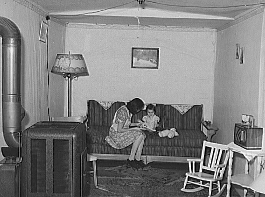 Interior of living room of married couple living in remodeled boxcar. Earl Fruit Company ranch. Kern County, California Photo: Russell Lee
