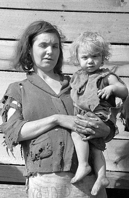 Mother and baby of family of nine living in field on U.S. Route 70 in Tennessee, near Tennessee River  Photo: Csrl Mydans