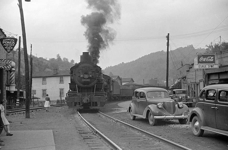 Train pulling coal through center of town morning and evening, Osage, West Virginia   Photo: Marion Post Wolcott