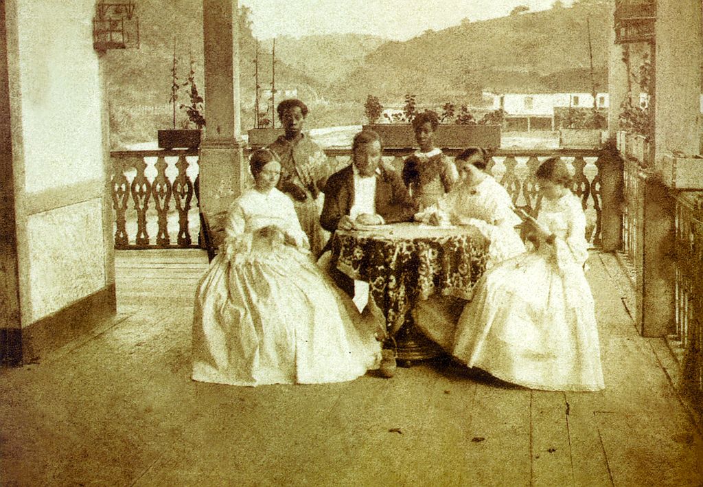 Brazilian family with house slaves, late 19th century