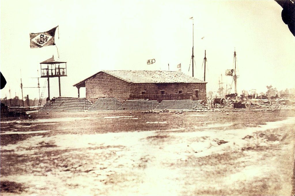 he port of Humaitá fortress seen from land and at the background, the masts of the anchored Brazilian warships, c.1868