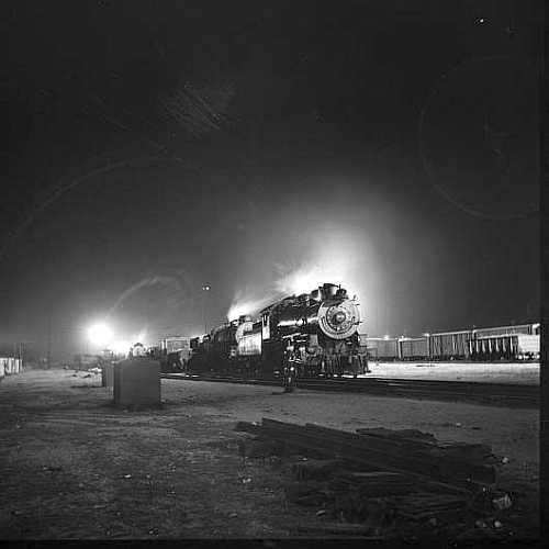 Barstow, California. A view of the Atchison, Topeka and Santa Fe Railroad yard at night  Photo: Jack Delano