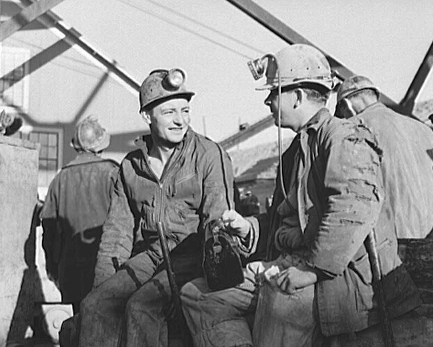 Butte, Montana. Anaconda Copper Mining Company. Copper miners waiting to go down in the cage Photo: Russell Lee