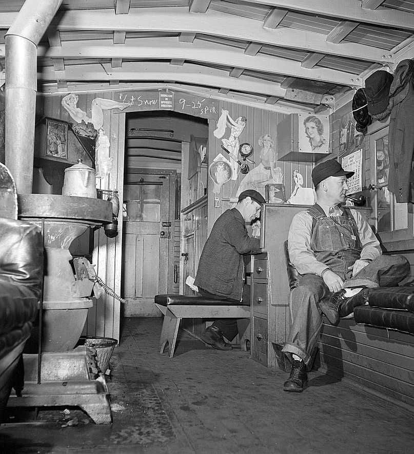 Freight train operations on the Chicago and Northwestern Railroad. Caboose is conductor's second home.  Photo: Jack Delano