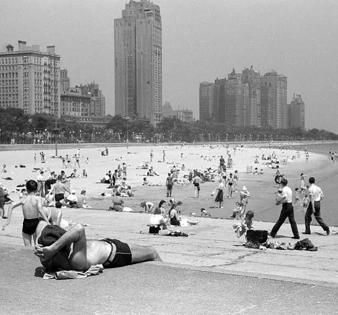 Public bathing beach. Chicago, Illinois. Gold Coast in background                          Photo: John Vachon