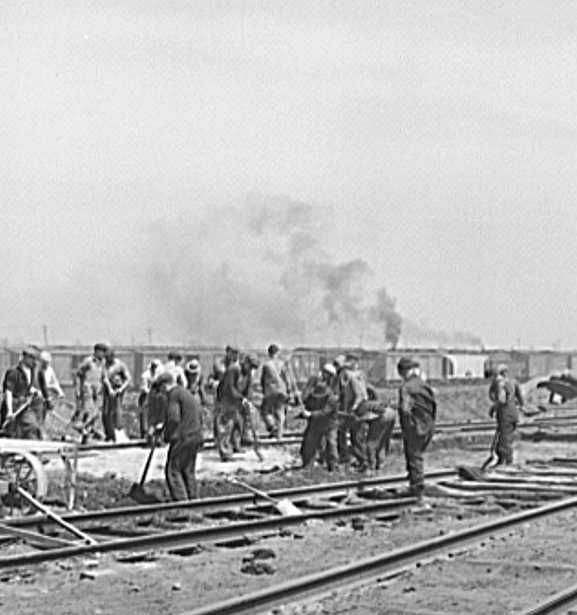 Gandy-dancer crew working in Bensenville yard of the Chicago, Milwaukee, Saint Paul and Pacific Railroad   Photo: Jack Delano