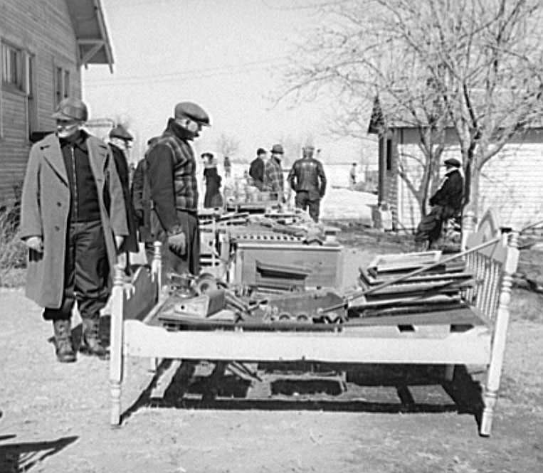 Nebraska farm auction items examined  - Photo: Arthur Rothstein