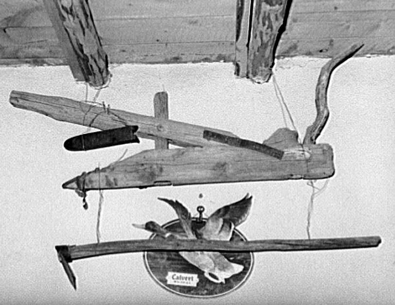 Old handmade plow and hoe in liquor store. Costilla, New Mexico    Photo: Russell Lee