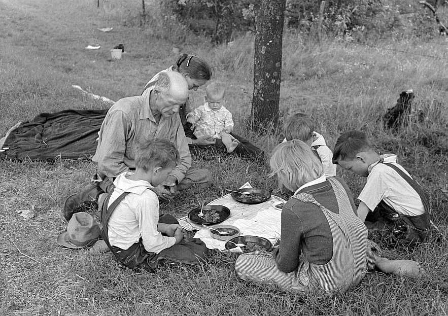 Migrant family saying grace beside roadside, east of Fort Gibson, Oklahoma  Photo: Russell Lee