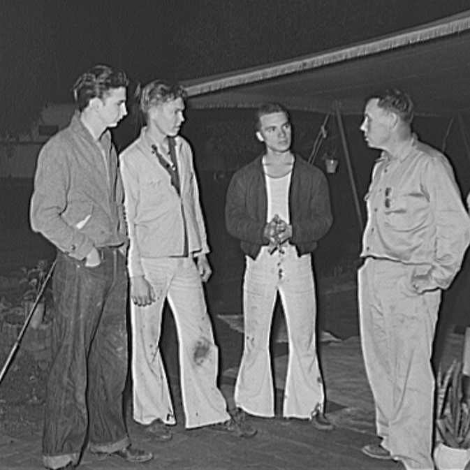 Three boys who have come down from Los Angeles looking for work talking to a friend who is already employed. San Diego, California. - Russell Lee