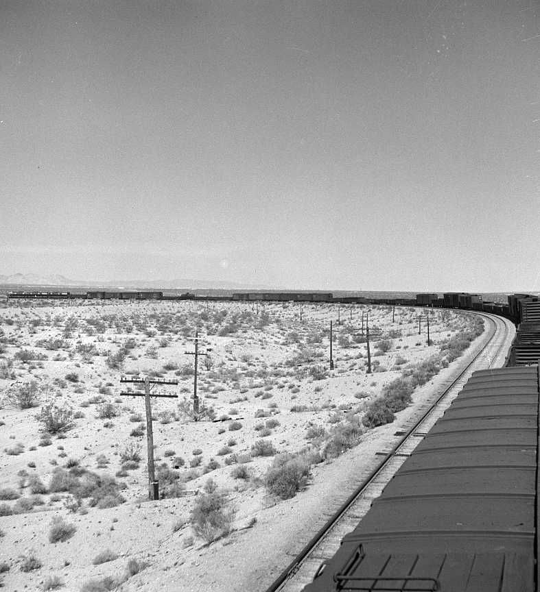  A diesel freight train going around a curve on the Atchison, Topeka and Santa Fe Railroad between Needles and Barstow Photo: Jack Delano