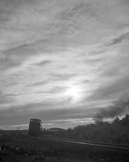 A westbound local freight train passing on the Atchison, Topeka and Santa Fe Railroad between Winslow and Seligman, Arizona  Photo: Jack Delano